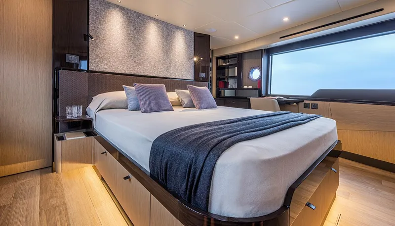  Yacht Photos Pics Luxurious bedroom interior of 2024 Absolute 56 FLY yacht with modern design and large window.