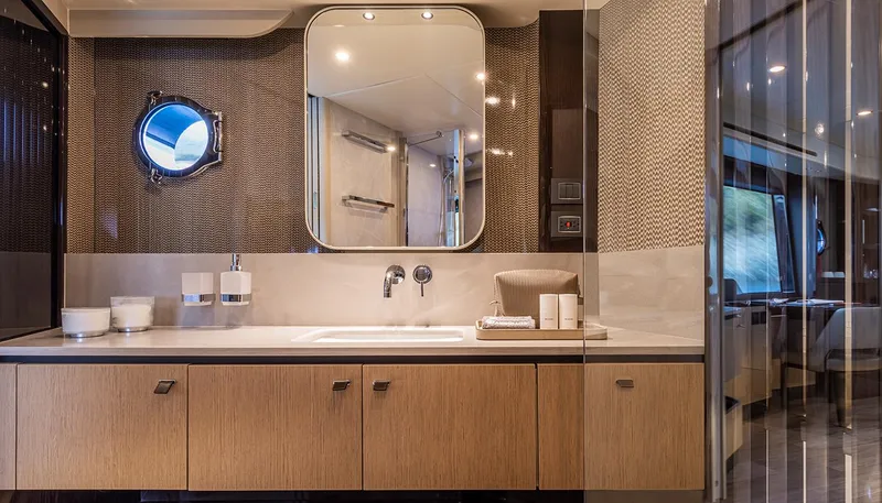  Yacht Photos Pics Luxurious bathroom interior of 2024 Absolute 56 FLY yacht with modern fixtures and elegant design.