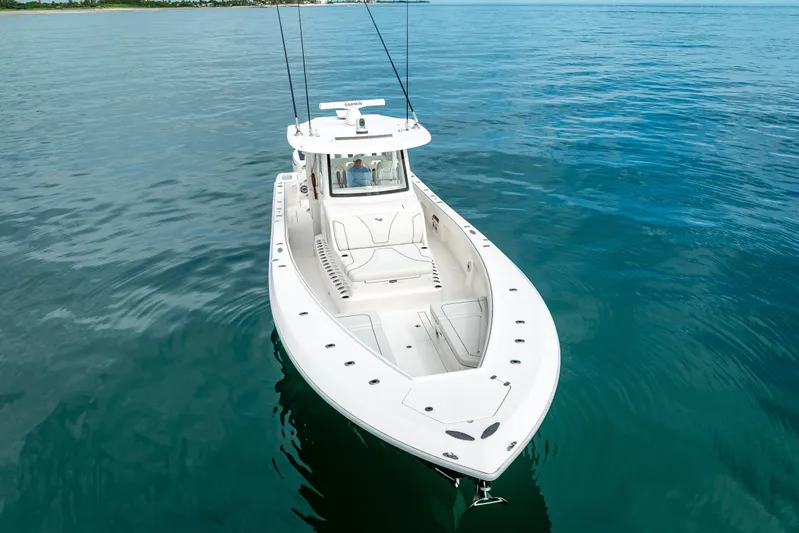  Yacht Photos Pics 2024 SeaVee 420Z boat on calm blue water, showcasing sleek design and spacious deck.