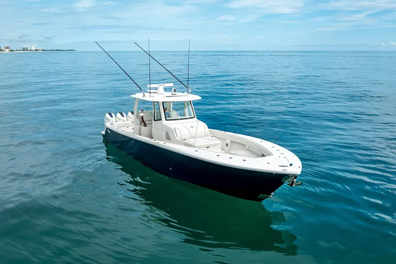  Yacht Photos Pics 2024 SeaVee 420Z boat on calm ocean waters under a clear blue sky.