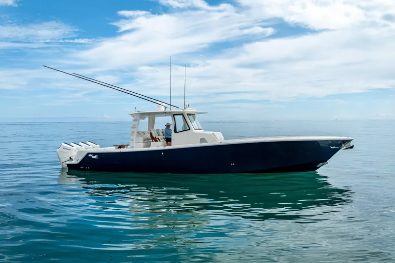  Yacht Photos Pics 2024 SeaVee 420Z boat on calm ocean waters under a clear sky.