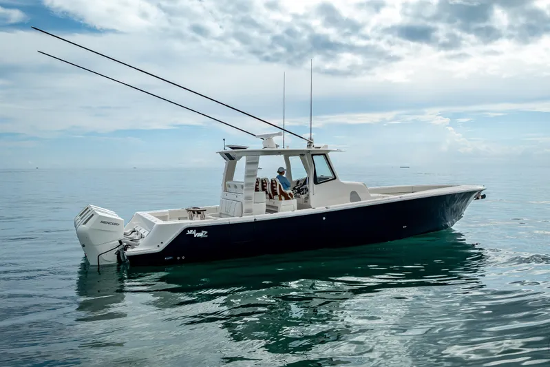  Yacht Photos Pics 2024 SeaVee 420Z boat on calm ocean waters under cloudy sky.