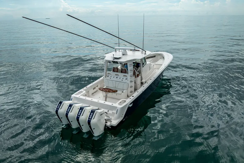  Yacht Photos Pics 2024 SeaVee 420Z boat with triple outboard engines on calm ocean waters.