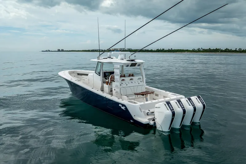  Yacht Photos Pics 2024 SeaVee 420Z boat with quad engines on calm ocean waters.