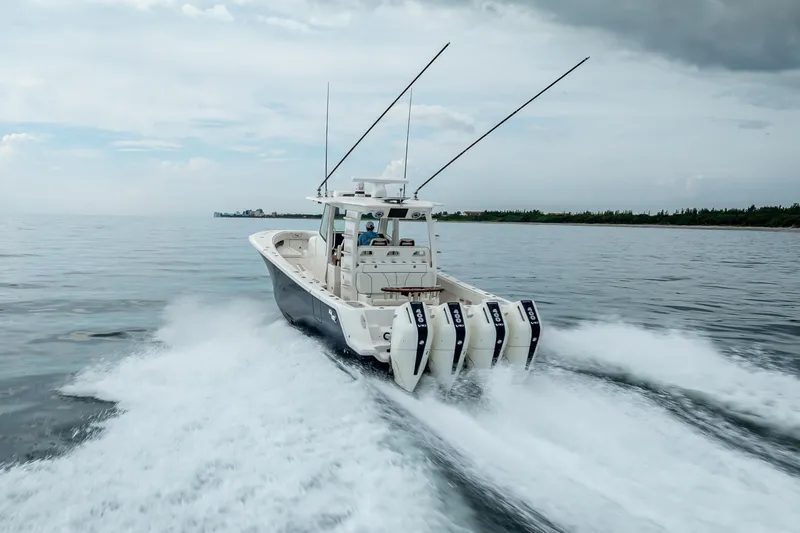  Yacht Photos Pics 2024 SeaVee 420Z boat cruising on open water with four powerful engines.