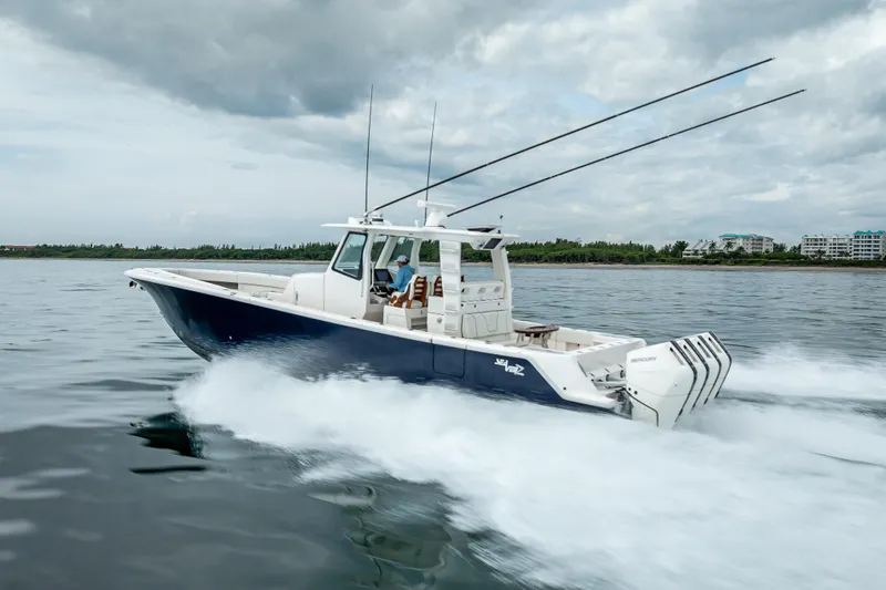  Yacht Photos Pics 2024 SeaVee 420Z boat cruising on open water under cloudy skies.