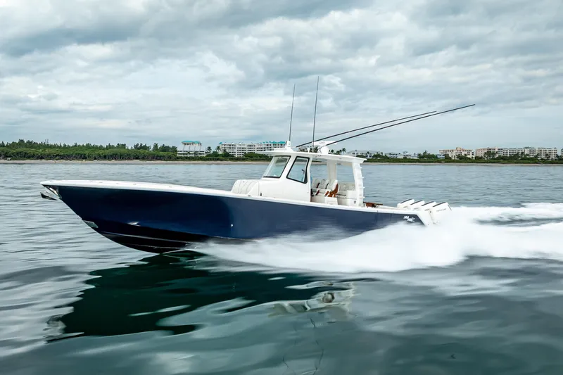  Yacht Photos Pics 2024 SeaVee 420Z boat cruising on water under cloudy skies.