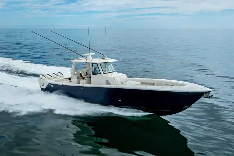  Yacht Photos Pics 2024 SeaVee 420Z boat cruising on calm ocean waters.