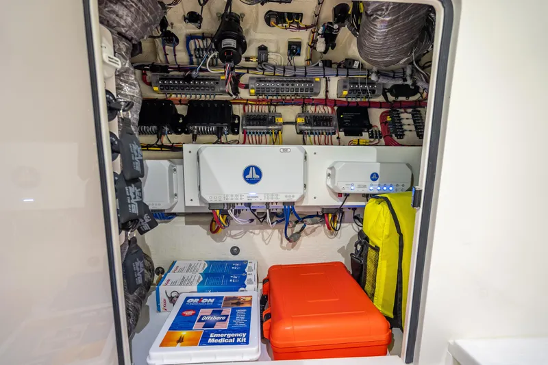  Yacht Photos Pics Electrical compartment of 2024 SeaVee 420Z boat with emergency medical kits and wiring systems.