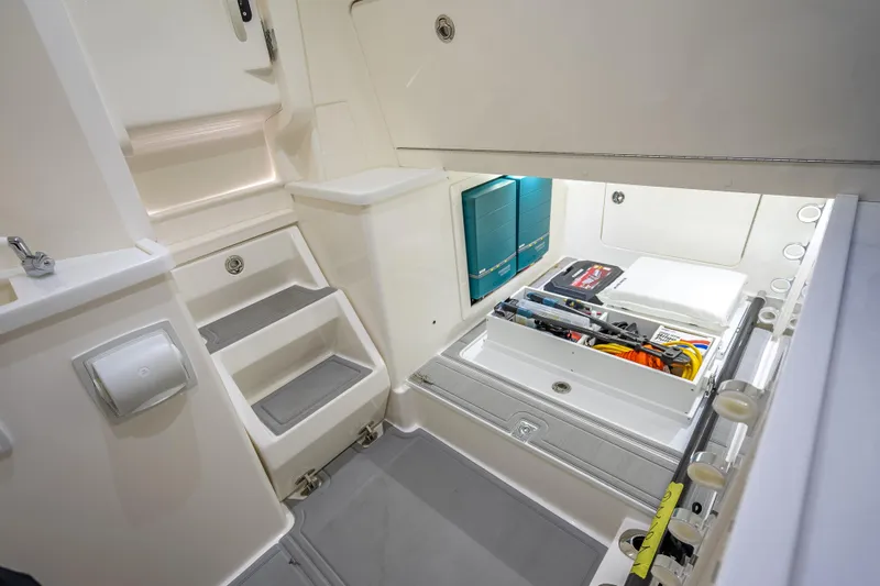  Yacht Photos Pics 2024 SeaVee 420Z interior storage compartment with organized tools and equipment.