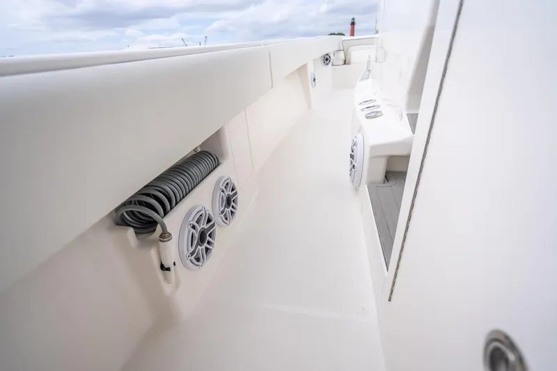  Yacht Photos Pics 2024 SeaVee 420Z boat deck with speakers and coiled hose, showcasing modern design.