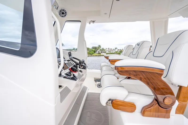  Yacht Photos Pics 2024 SeaVee 420Z boat interior with luxurious white seating and wooden accents.
