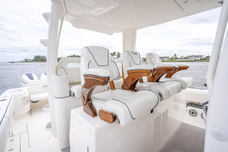  Yacht Photos Pics 2024 SeaVee 420Z luxury boat interior with elegant seating and scenic water view.