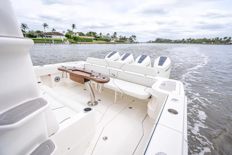  Yacht Photos Pics 2024 SeaVee 420Z boat with multiple outboard engines cruising on a scenic waterway.