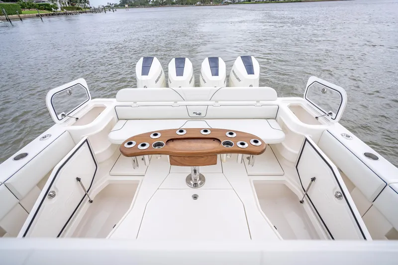  Yacht Photos Pics 2024 SeaVee 420Z boat interior with seating, table, and four outboard engines.