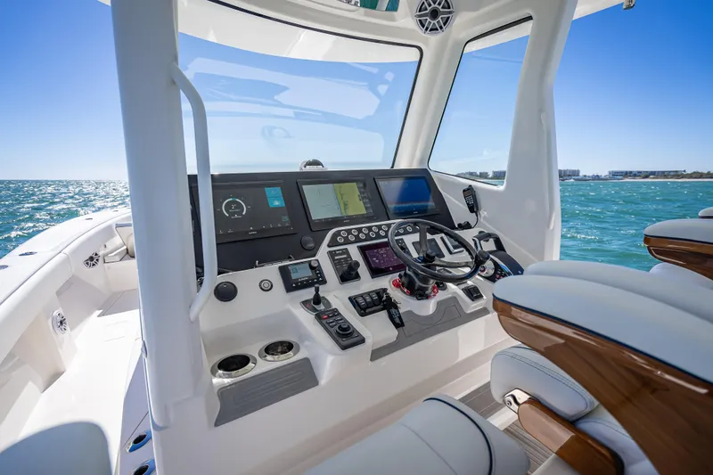 Yacht Photos Pics 2024 SeaVee 420Z boat cockpit with advanced navigation system and ocean view.