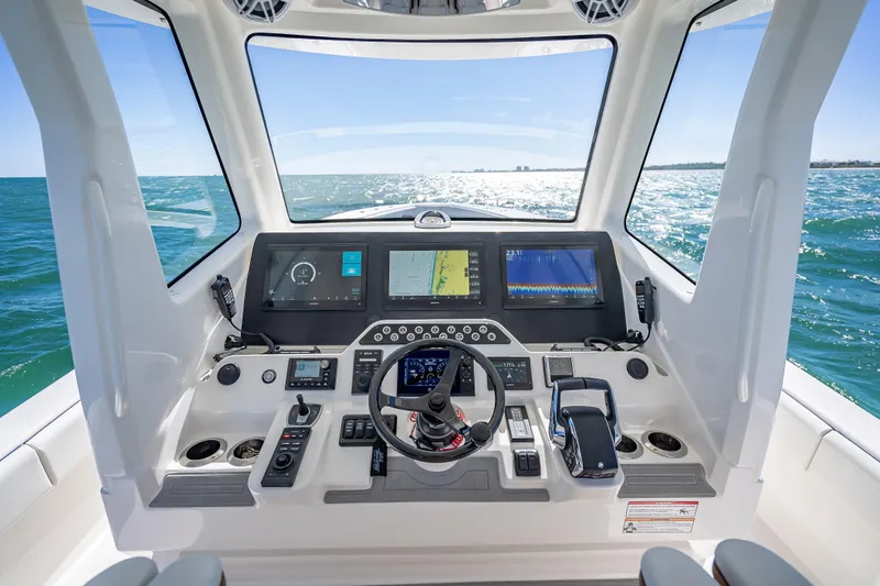  Yacht Photos Pics 2024 SeaVee 420Z helm with advanced navigation displays and ocean view.