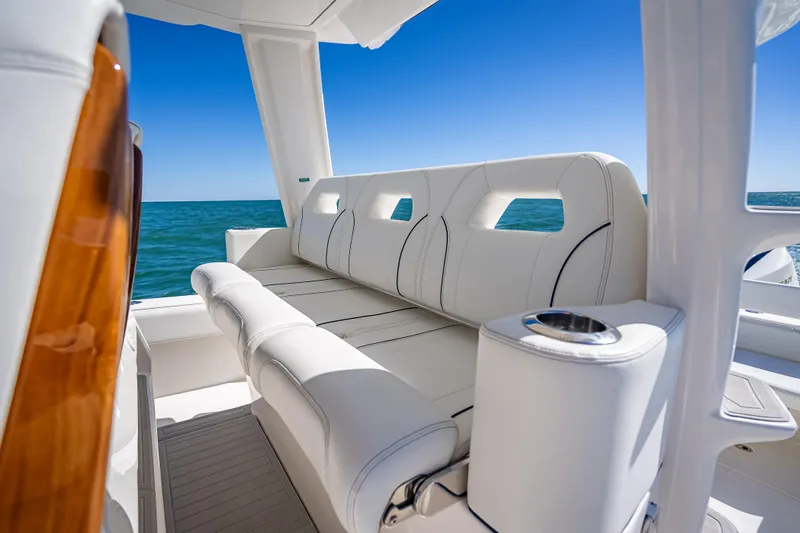  Yacht Photos Pics 2024 SeaVee 420Z boat interior with luxurious white seating and ocean view.