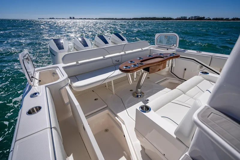  Yacht Photos Pics 2024 SeaVee 420Z boat interior with seating, table, and ocean view.