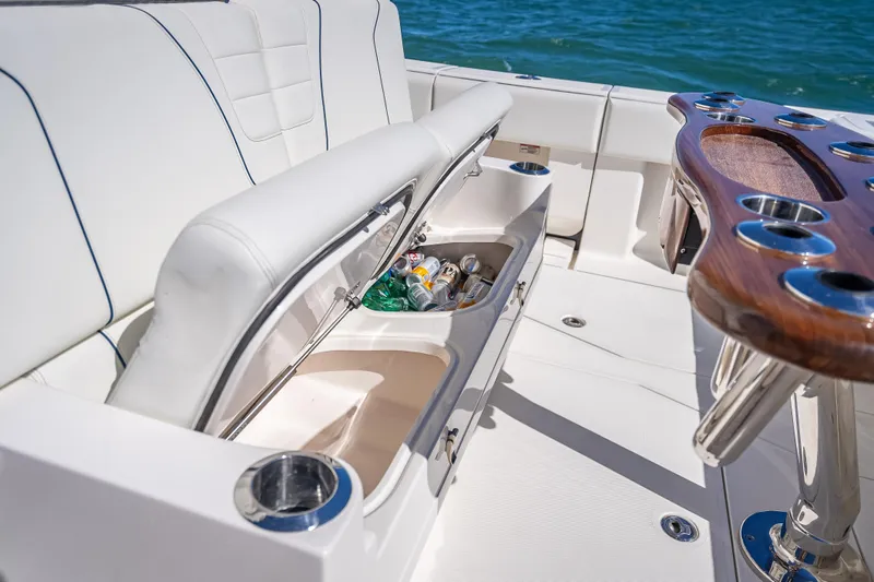  Yacht Photos Pics 2024 SeaVee 420Z boat interior with open storage compartment and beverage holders.