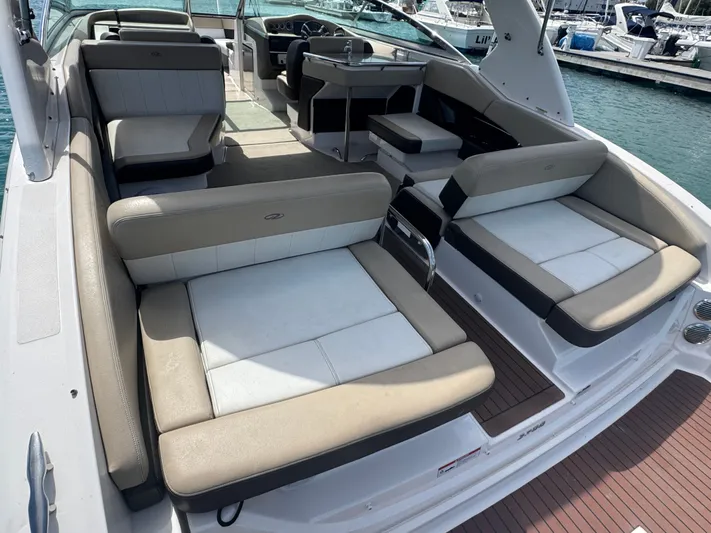  Yacht Photos Pics 2013 Regal 3200 Bowrider interior with spacious seating, docked at marina.