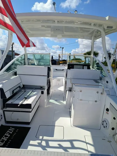  Yacht Photos Pics 2025 Blackfin 272 DC boat interior with seating, under a clear blue sky.