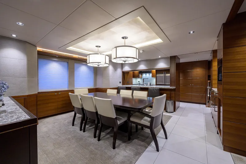 Lacey Kay Yacht Photos Pics Luxurious dining area on a 2017 Nordhavn 96 yacht with modern furnishings.