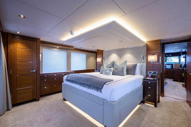 Lacey Kay Yacht Photos Pics Luxurious master bedroom on the 2017 Nordhavn 96 yacht with modern decor and ambient lighting.