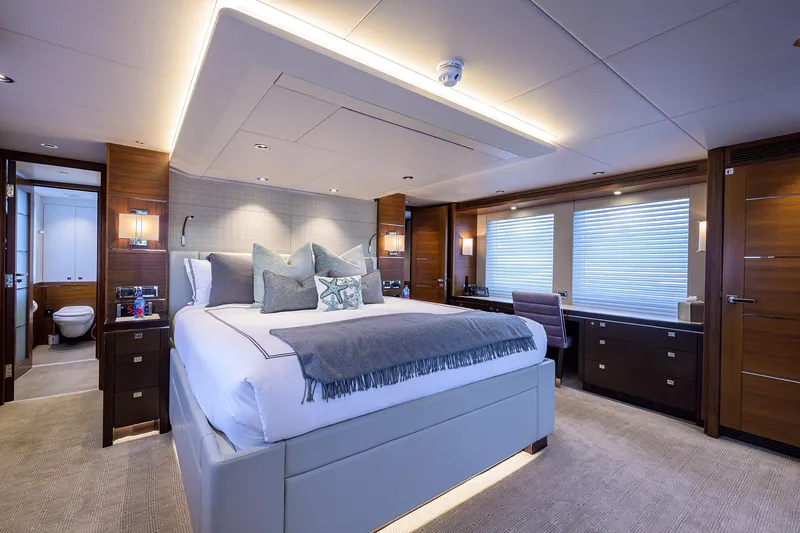 Lacey Kay Yacht Photos Pics Luxurious master bedroom on 2017 Nordhavn 96 yacht with modern decor and ample natural light.