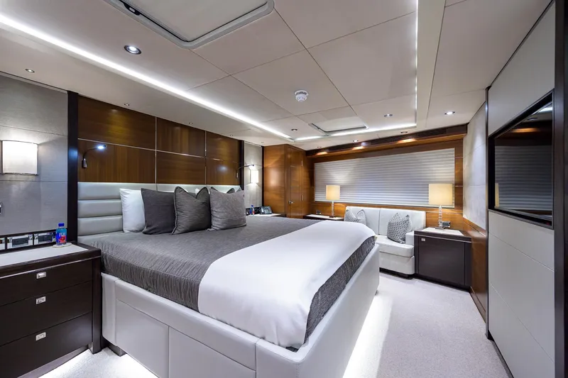 Lacey Kay Yacht Photos Pics Luxurious bedroom interior of 2017 Nordhavn 96 yacht with modern decor and ambient lighting.