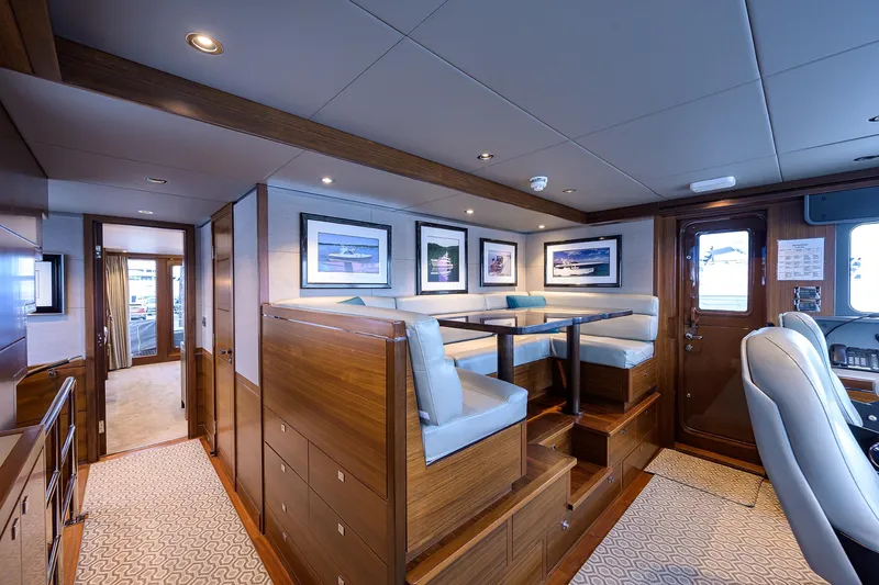 Lacey Kay Yacht Photos Pics Luxurious interior of 2017 Nordhavn 96 yacht with elegant seating and framed artwork.