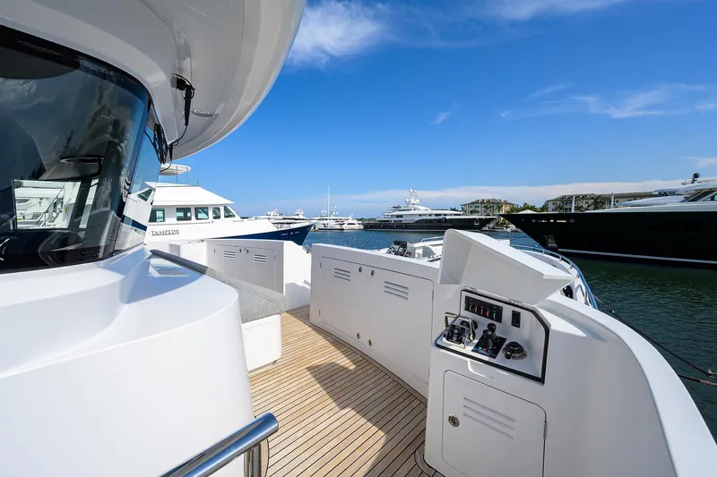 Lacey Kay Yacht Photos Pics 2017 Nordhavn 96 yacht deck with control panel, docked in a marina.