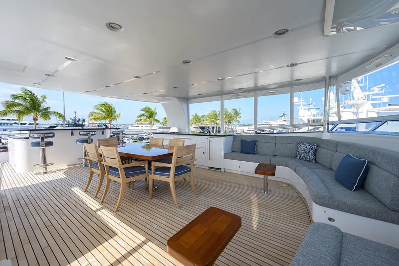 Lacey Kay Yacht Photos Pics Spacious deck of 2017 Nordhavn 96 yacht with seating and dining area.