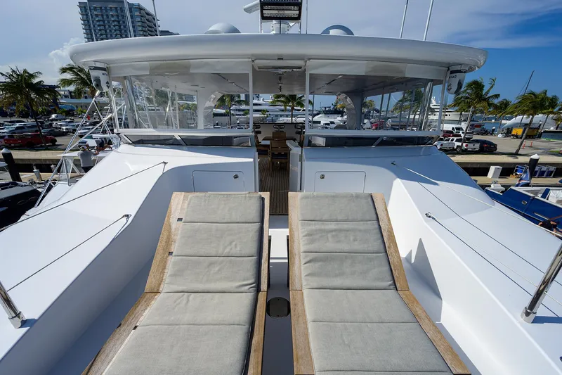 Lacey Kay Yacht Photos Pics 2017 Nordhavn 96 yacht with sun loungers on deck, docked at marina.