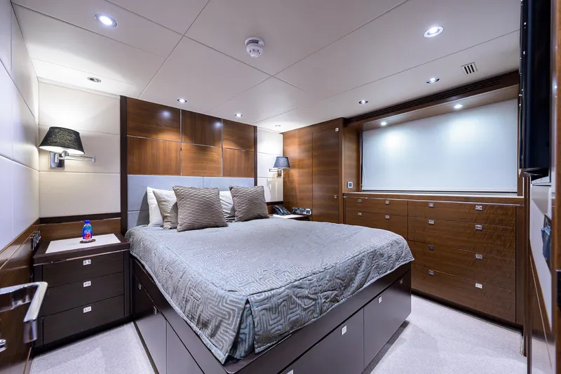 Lacey Kay Yacht Photos Pics Luxurious bedroom in a 2017 Nordhavn 96 yacht with modern wood finishes.