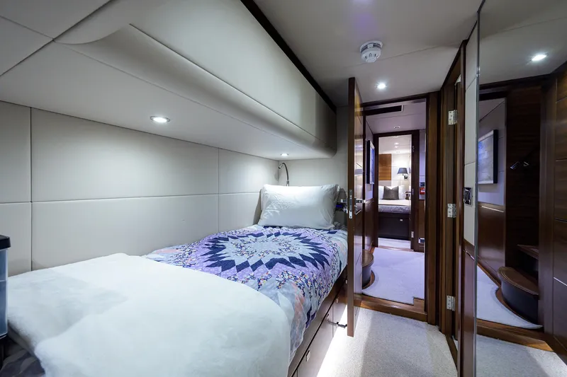 Lacey Kay Yacht Photos Pics Luxurious cabin interior of 2017 Nordhavn 96 yacht with single bed and modern decor.