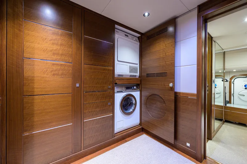 Lacey Kay Yacht Photos Pics Laundry area in 2017 Nordhavn 96 yacht with stacked washer and dryer.