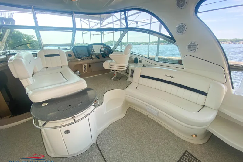  Yacht Photos Pics Luxurious interior of 2007 Sea Ray 52 Sundancer yacht with plush seating and helm.