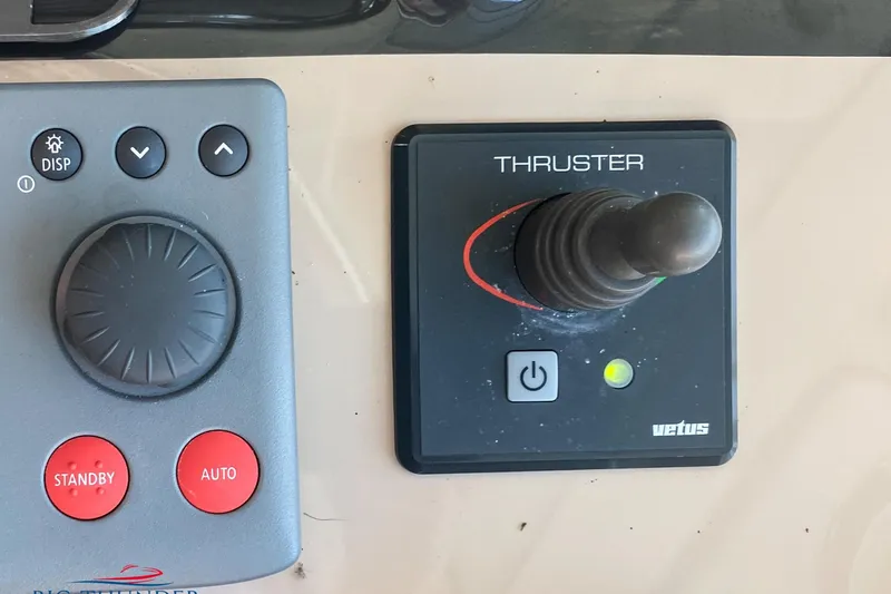  Yacht Photos Pics Control panel of a 2007 Sea Ray 52 Sundancer with thruster joystick and buttons.