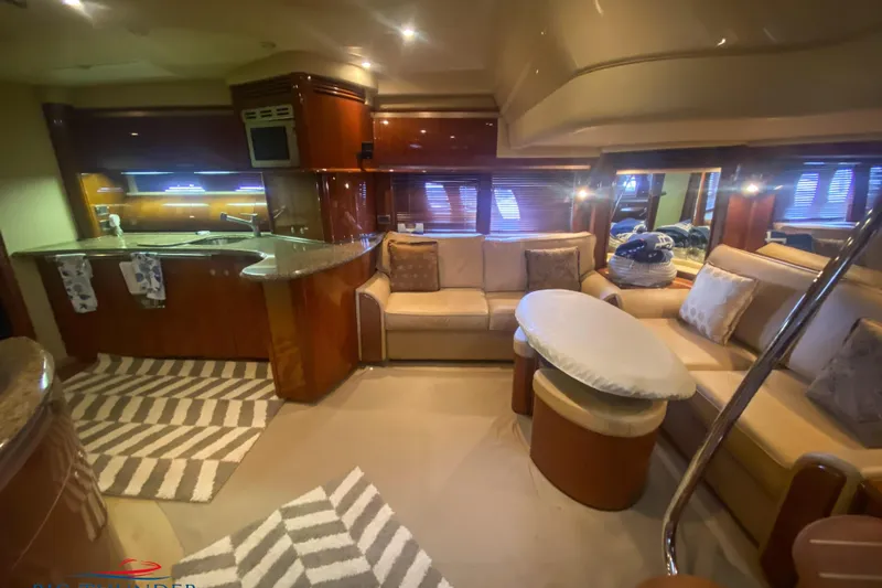  Yacht Photos Pics Luxurious interior of 2007 Sea Ray 52 Sundancer yacht with modern kitchen and cozy seating area.