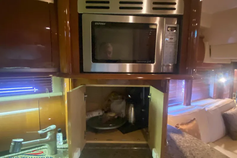  Yacht Photos Pics 2007 Sea Ray 52 Sundancer yacht kitchen with microwave and open cabinet.