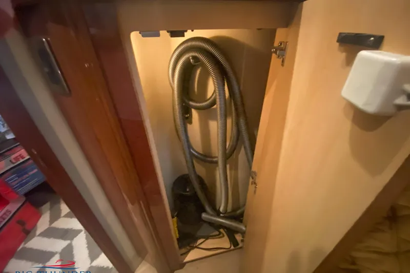  Yacht Photos Pics Storage compartment with coiled hose inside a 2007 Sea Ray 52 Sundancer yacht.