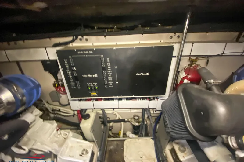  Yacht Photos Pics Engine room of a 2007 Sea Ray 52 Sundancer with control panel and fire extinguisher.