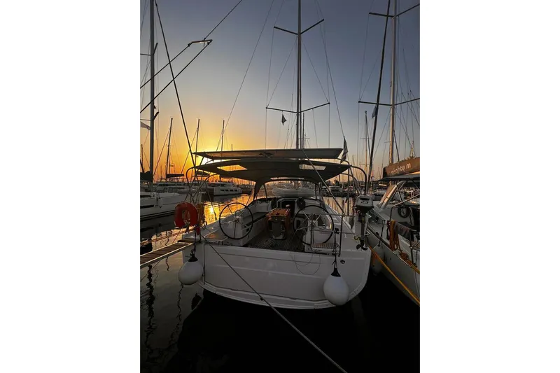  Yacht Photos Pics Beneteau Oceanis 40.1 sailboat docked at sunset, 2022 model.