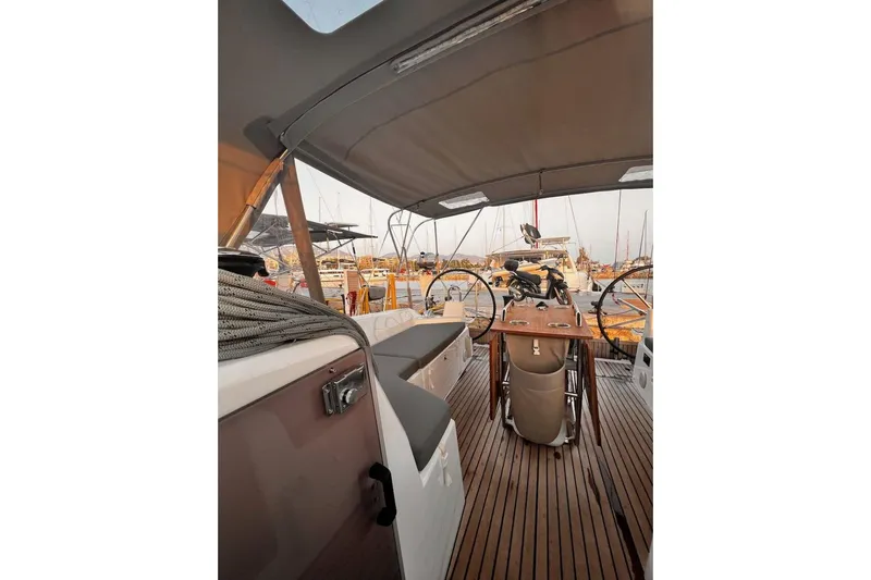  Yacht Photos Pics 2022 Beneteau Oceanis 40.1 yacht cockpit with dual steering wheels and wooden deck.