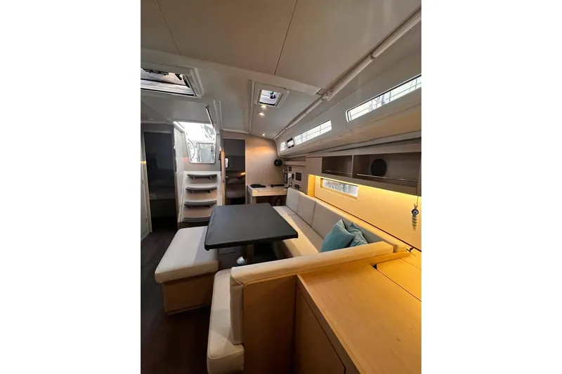  Yacht Photos Pics Interior of 2022 Beneteau Oceanis 40.1 yacht, featuring modern seating and dining area.