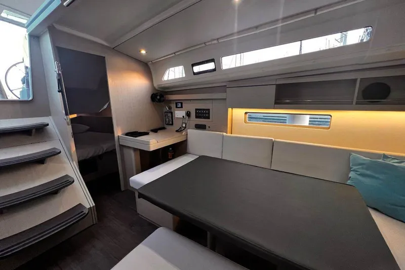 Yacht Photos Pics Interior of 2022 Beneteau Oceanis 40.1 yacht, featuring modern seating and ambient lighting.