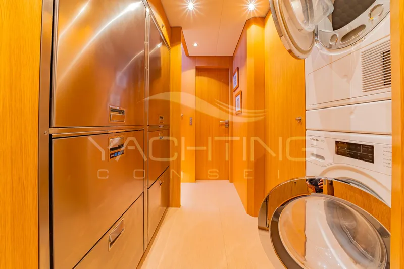 4ever Yacht Photos Pics Laundry area on JFA Yachts LONG ISLAND 78 POWER, 2022 model, featuring modern appliances.