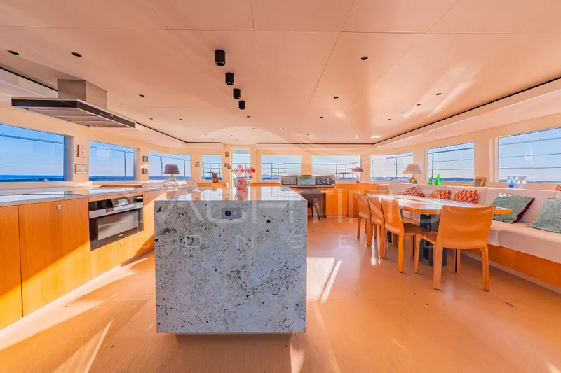 4ever Yacht Photos Pics Luxurious interior of 2022 JFA Yachts LONG ISLAND 78 POWER, featuring modern dining and kitchen area.