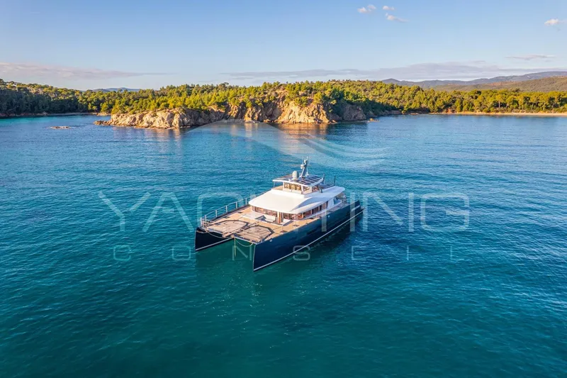 4ever Yacht Photos Pics Luxurious 2022 JFA Yachts LONG ISLAND 78 POWER cruising in serene coastal waters.